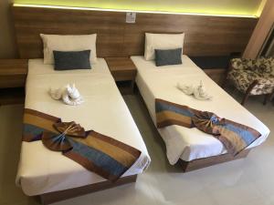 Postel nebo postele na pokoji v ubytování Unity Hotel