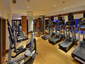 a gym with several treadmills and cardio machines at Tugcan Hotel in Gaziantep