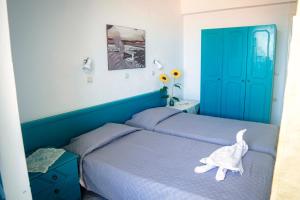 Säng eller sängar i ett rum på Angela Thalia Apartments