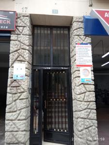 an entrance to a building with a revolving door at Como en casa in Alicante