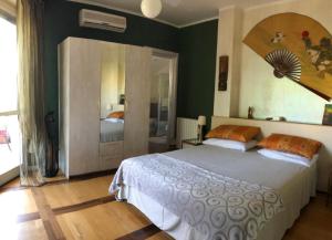 Voodi või voodid majutusasutuse B&B Via Roma toas