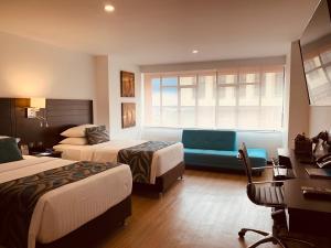 Postelja oz. postelje v sobi nastanitve Hotel Dann Cali