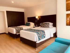 Postelja oz. postelje v sobi nastanitve Hotel Dann Cali