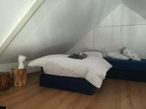 Postel nebo postele na pokoji v ubytování Hofstede 's Gravenhoek