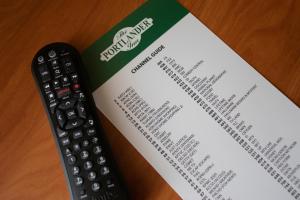 a remote control sitting on top of a book at The Portlander Inn and Marketplace in Portland