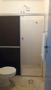 a bathroom with a toilet and a shower stall at Bed & breakfast Villa Carmo in Salvador