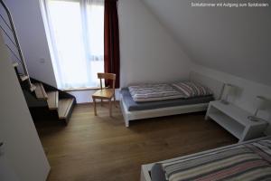 Postel nebo postele na pokoji v ubytování Ferienhaus Sonnensteg 23