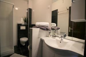 Kúpeľňa v ubytovaní Dr. IGDA Apartments