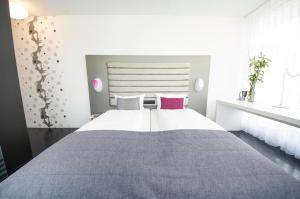 Postel nebo postele na pokoji v ubytování Sky Design Motel