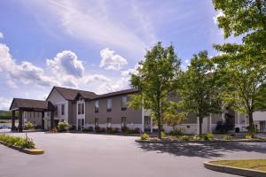 a rendering of the exterior of a building at Best Western Plus University Inn in Olean