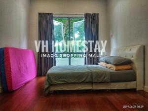 a bedroom with a bed and a window with curtains at VH Homes, Imago Shopping Mall in Kota Kinabalu +22 photos