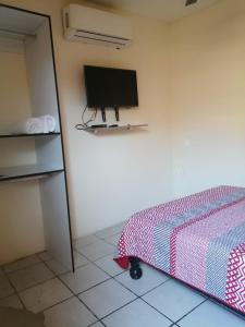 Et tv og/eller underholdning på Hotel Puerto Viejo