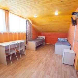 a room with a bed and a table in it at Mebis Baikal in Turkinski