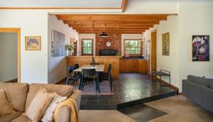 a living room with a couch and a table at McLaren Vale Getaways in McLaren Flat