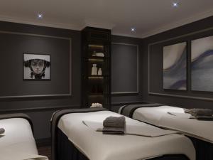 Voodi või voodid majutusasutuse Grande Collection Hotel & Spa toas