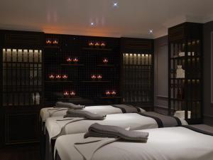 Voodi või voodid majutusasutuse Grande Collection Hotel & Spa toas