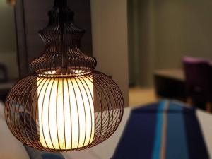 a light that is on top of a table at Bizotel Premier Hotel & Residence in Bangkok