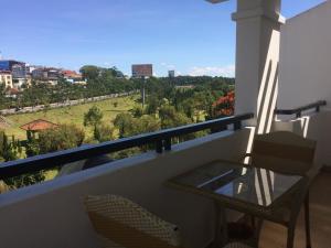 a balcony with a table and chairs and a view at Phuong Vy Hotel in Da Lat