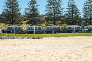 a view of the house from the beach at Tuross Beach Cabins & Campsites in Tuross Heads