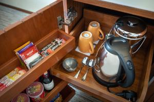 a wooden box with a kitchen utensils and a blender at Traders Hotel, Kuala Lumpur in Kuala Lumpur