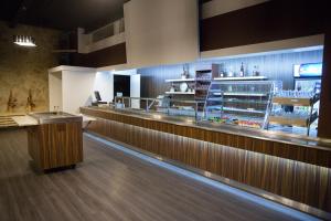 a bar in a restaurant with a counter and a counter at Villa Wesenbergh in Rakvere