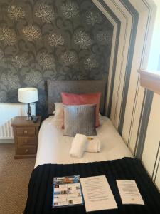 a bedroom with a bed with a black and white wall at Drumdale Bed and Breakfast in Inverness +34 photos