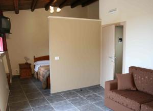 A bed or beds in a room at Agriturismo Al Casale