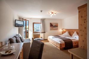 Posteľ alebo postele v izbe v ubytovaní Hotel Walchseer Hof