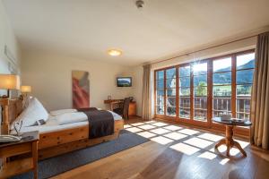 Postel nebo postele na pokoji v ubytování Hotel Walchseer Hof
