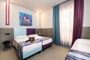 Postel nebo postele na pokoji v ubytování Hotel Relais Dei Papi + 37 fotografií