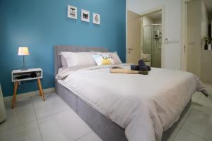 Letto o letti in una camera di New Family Suite Freewifi @Icon City Petaling Jaya