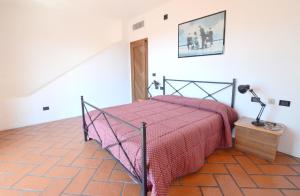 A bed or beds in a room at Villa Manuela - ArgonautiVacanze