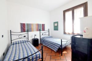 A bed or beds in a room at Villa Manuela - ArgonautiVacanze