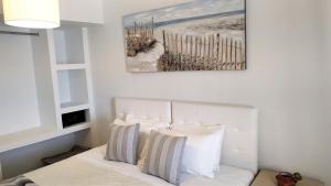 Uma cama ou camas num quarto em Hotel Mylos