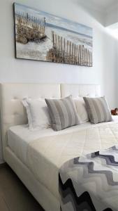 Uma cama ou camas num quarto em Hotel Mylos