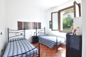 A bed or beds in a room at Villa Manuela - ArgonautiVacanze