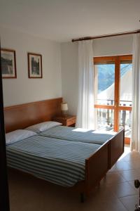 Postel nebo postele na pokoji v ubytování Albergo Miravalle