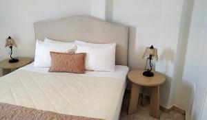 Uma cama ou camas num quarto em Hotel Mylos