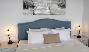 Uma cama ou camas num quarto em Hotel Mylos