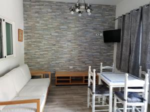 TV a/nebo společenská místnost v ubytování Vivienda Vacacional Meridiano