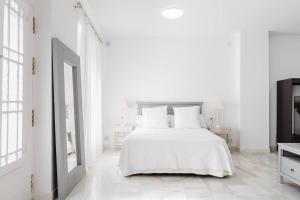 Posteľ alebo postele v izbe v ubytovaní Loft en primera linea del paseo marítimo