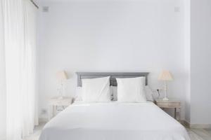 Posteľ alebo postele v izbe v ubytovaní Loft en primera linea del paseo marítimo