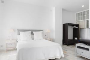Posteľ alebo postele v izbe v ubytovaní Loft en primera linea del paseo marítimo