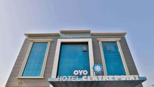 a building with the omo hotel center on it at HOTEL CENTRE POINT in Mundra