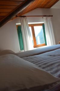 Postel nebo postele na pokoji v ubytování Albergo Miravalle