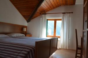 Postel nebo postele na pokoji v ubytování Albergo Miravalle