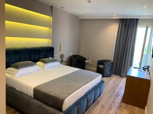 Postel nebo postele na pokoji v ubytování Light Hotel