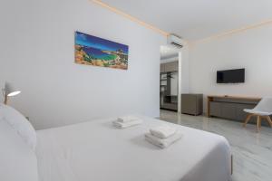 Postel nebo postele na pokoji v ubytování Olive Garden Hotel