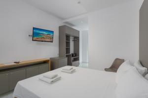 Postel nebo postele na pokoji v ubytování Olive Garden Hotel