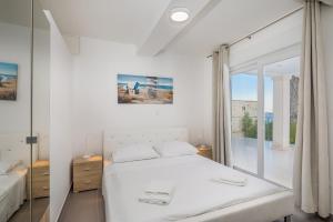 Posteľ alebo postele v izbe v ubytovaní Villa Oceanus + 37 fotografií